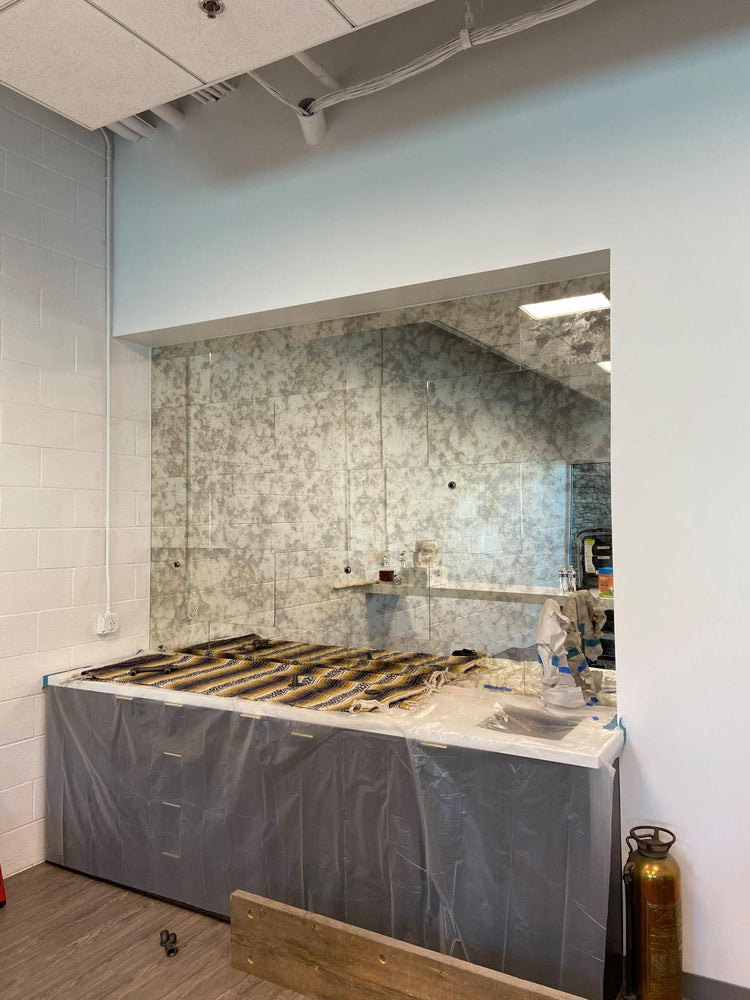 BACKSPLASH OF A BAR USING 12" X 12" OLD CHICAGO ANTIQUE MIRROR GLASS TILES